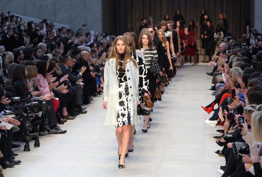 Models wear designs created by Burberry Prorsum during London Fashion Week, at Kensington Gardens in west London, Monday, Feb. 18, 2013. (Photo by Joel Ryan/Invision/AP)