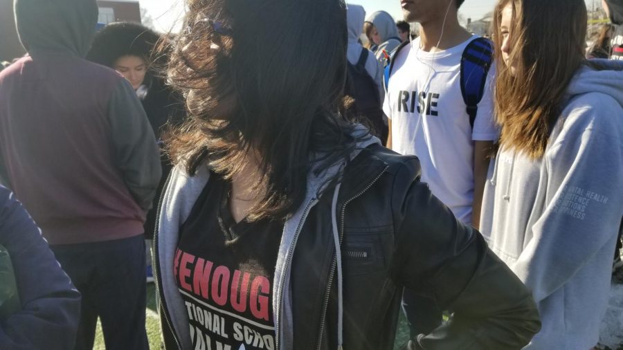 Student wears #enough shirt during FPMs participation in National Walkout Day