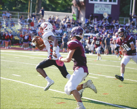 Senior Charles Mealing hauls in a catch from Mitch Kozak.