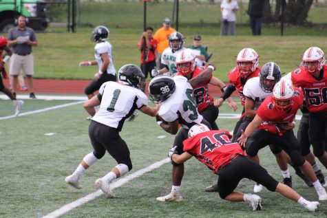 Chris Schiavone tackles a Valley Stream North player behind the line in the Knights 34-6 homecoming victory.